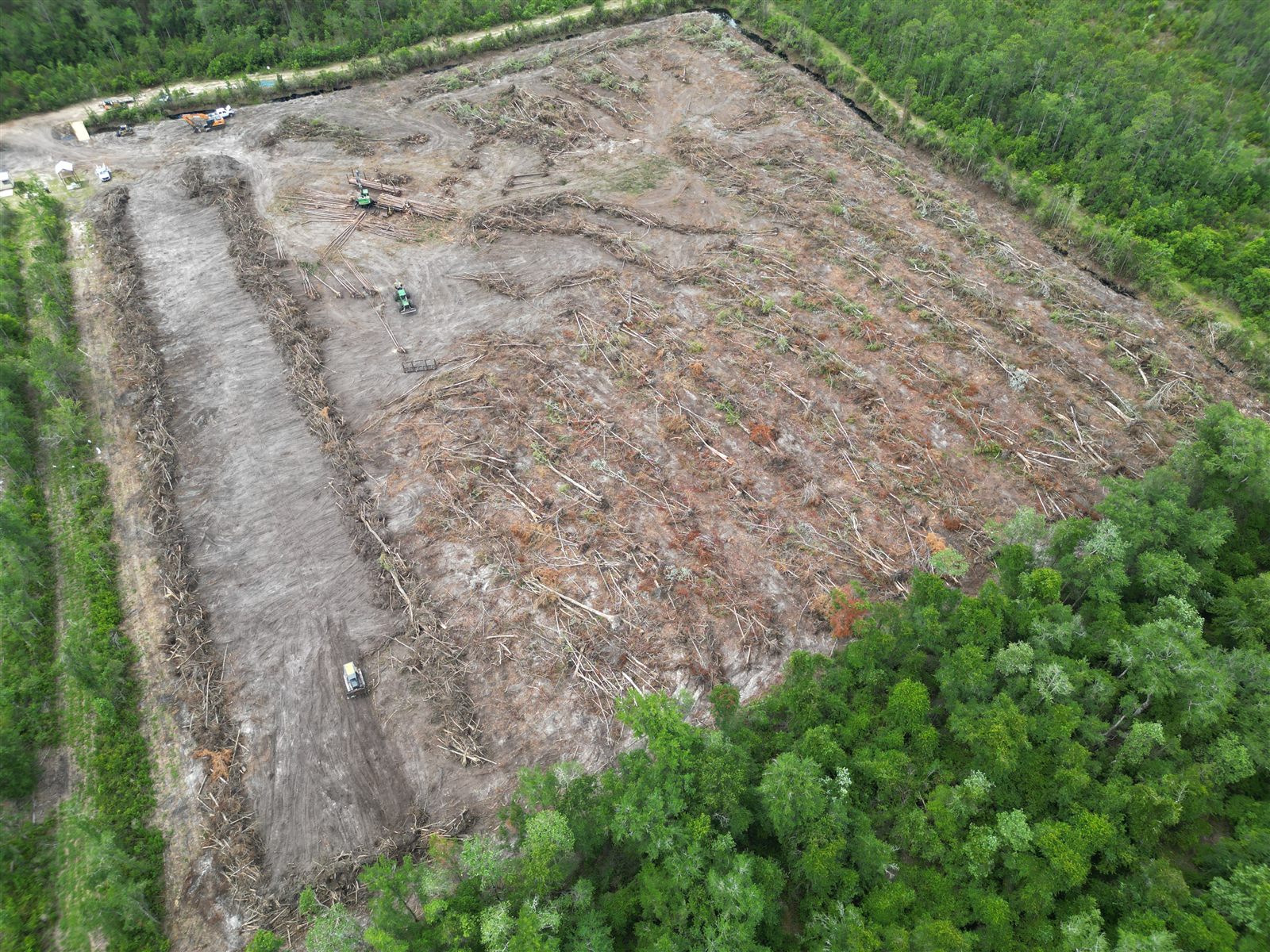 Aerial view of land clearing in progress with equipment working