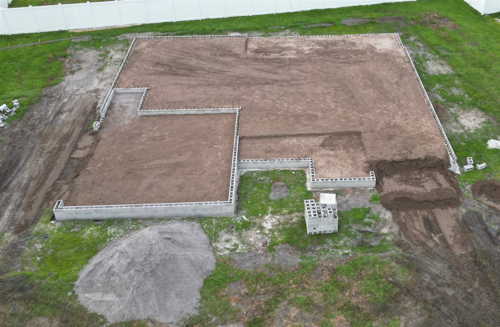 Stem wall foundation pad filled and compacted by Triple H Excavation