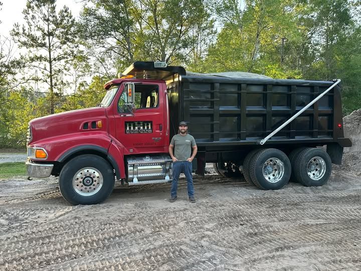 Tyler with the Triple H dump truck loaded with fill dirt